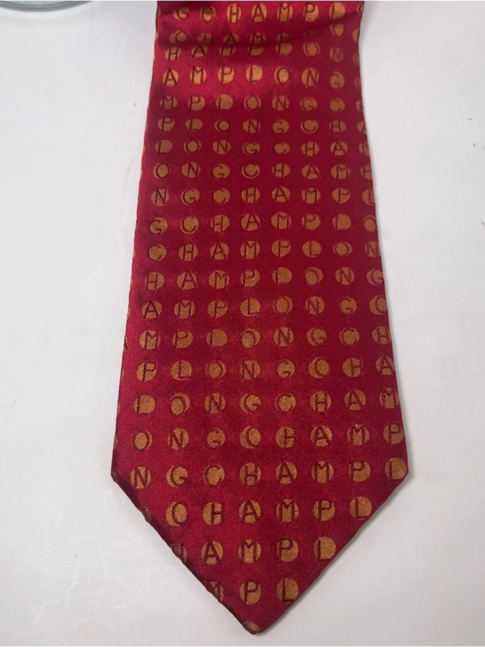 Longchamp Men’s Silk Tie Red with Gold Circles Dots Spelling LONGCHAMP Luxury